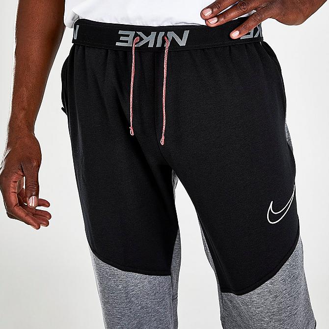 On Model 6 view of Men's Nike Therma-FIT Training Pants in Black/Heather/Black/White Click to zoom