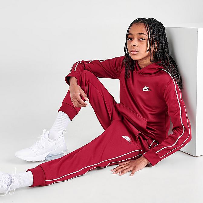 Front view of Kids' Nike Futura Repeat Tape Jogger Pants in Team Red/White Click to zoom