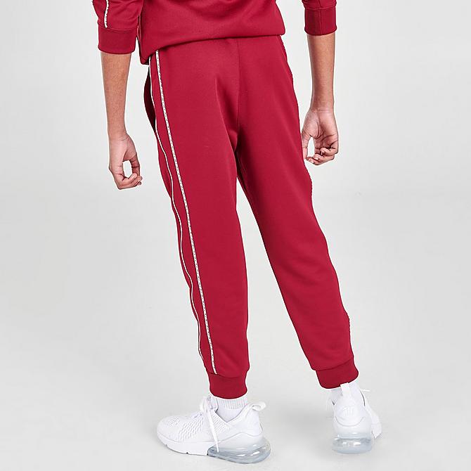 Back Right view of Kids' Nike Futura Repeat Tape Jogger Pants in Team Red/White Click to zoom