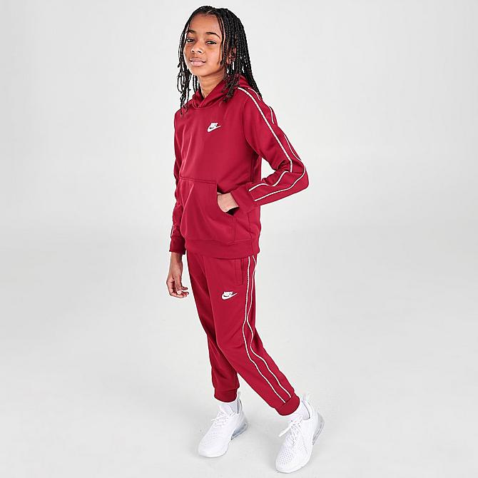 Front Three Quarter view of Kids' Nike Sportswear Repeat Tape Hoodie in Team Red/White Click to zoom