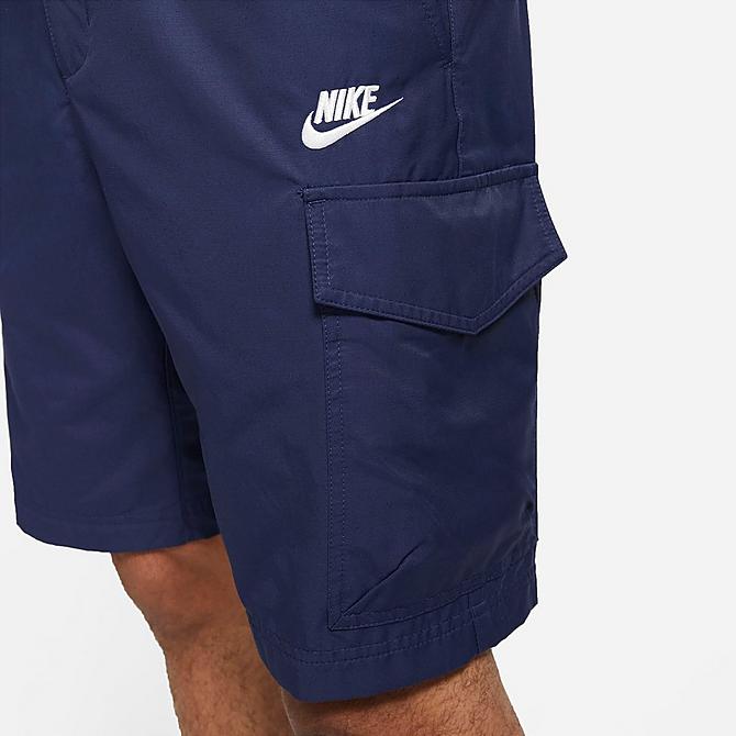 On Model 5 view of Men's Nike Sportswear Unlined Utility Cargo Shorts in Navy/White Click to zoom