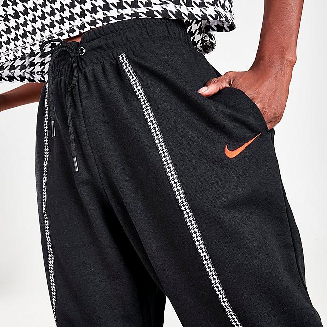 On Model 6 view of Women's Nike Sportswear Icon Clash Houndstooth Jogger Pants in Black/Chile Red Click to zoom