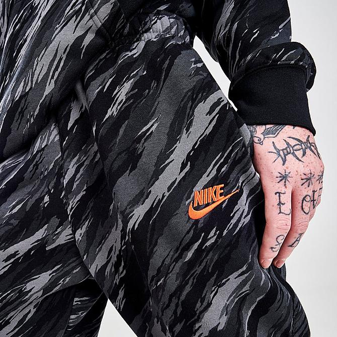 On Model 5 view of Men's Nike Sportswear Sport Essentials+ Club Fleece Sweatpants in Black/Orange Click to zoom