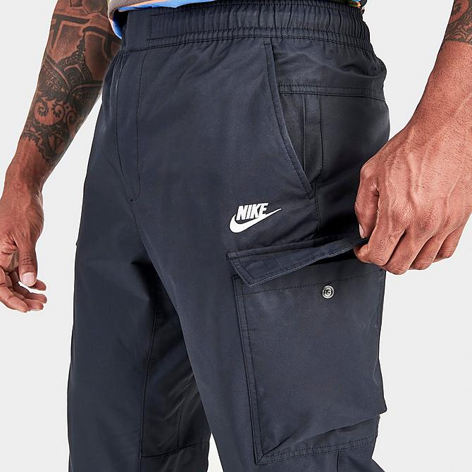On Model 5 view of Men's Nike Sportswear Tech Essentials Unlined Cargo Commuter Pants in Black/White Click to zoom