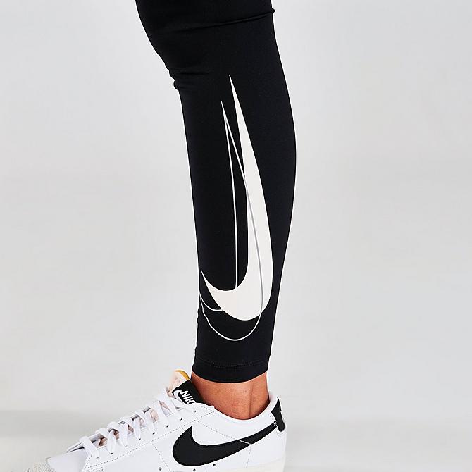 On Model 6 view of Women's Nike Dri-FIT Swoosh Run Mid-Rise Cropped Running Leggings in Black/White Click to zoom