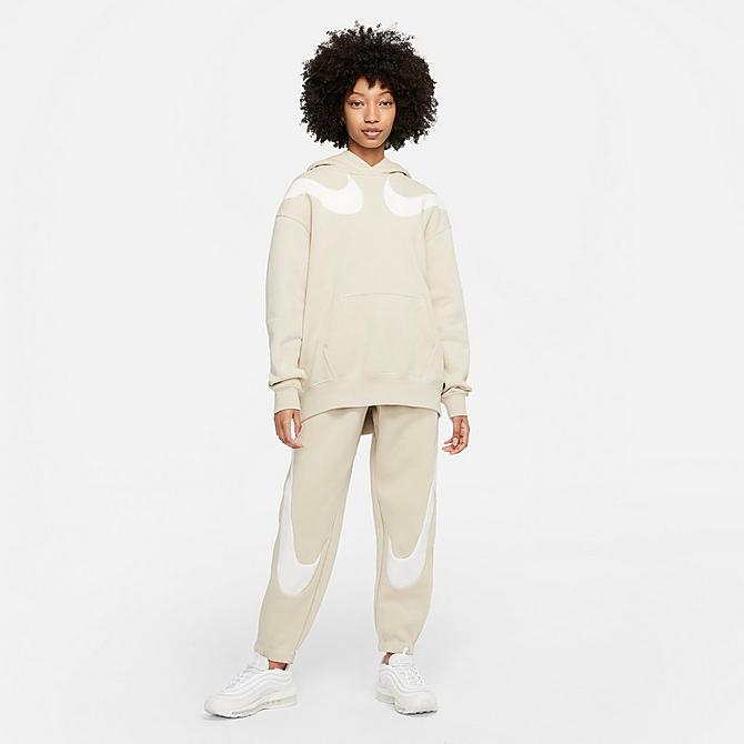Front Three Quarter view of Women's Nike Sportswear Double Swoosh Oversized Fleece Hoodie in Rattan/Sail/Sail Click to zoom