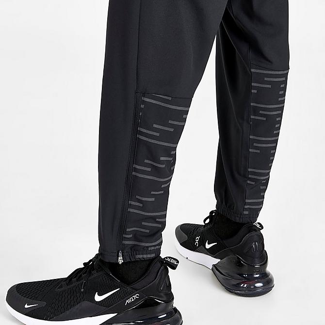 On Model 6 view of Men's Nike Dri-FIT Run Division Challenger Running Pants in Black/Reflective Silver Click to zoom