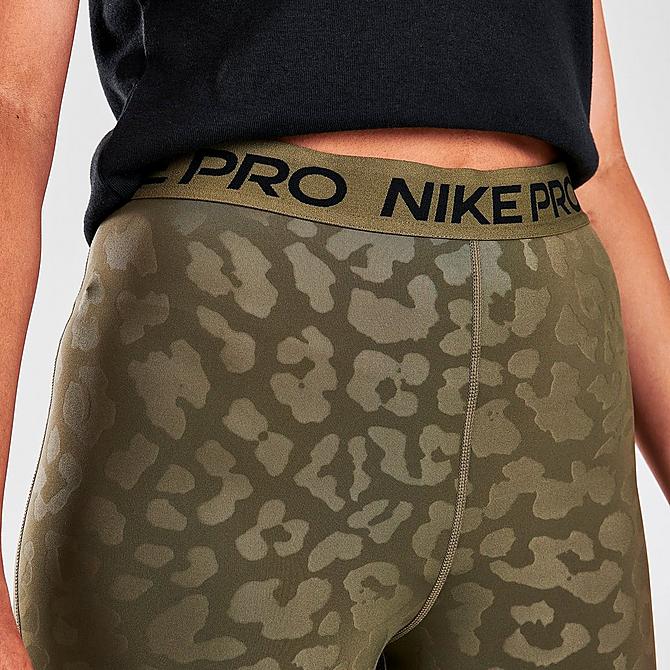 On Model 5 view of Women's Nike Pro Dri-FIT High-Waisted Cropped Length Leopard Print Leggings in Medium Olive/Clear Click to zoom