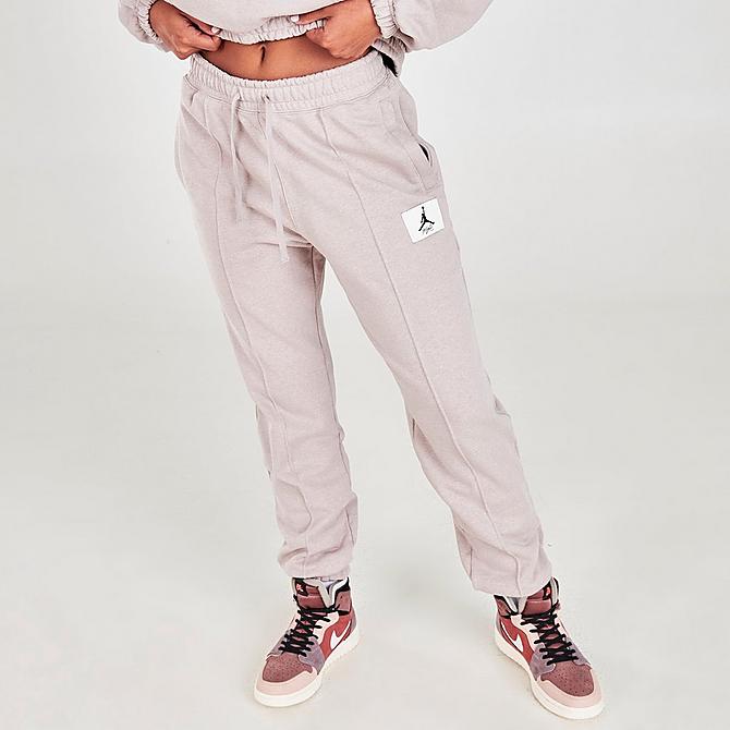 Front Three Quarter view of Women's Jordan Essentials Fleece Jogger Pants in Moon Particle/Heather/Thunder Grey Click to zoom