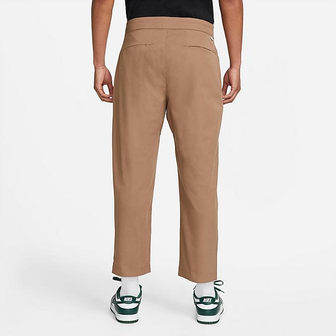 Front Three Quarter view of Men's Nike Sportswear Style Essentials Sneaker Unlined Woven Cropped Pants in Archaeo Brown/Sail/Ice Silver/Archaeo Brown Click to zoom