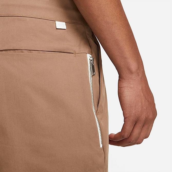 On Model 5 view of Men's Nike Sportswear Style Essentials Sneaker Unlined Woven Cropped Pants in Archaeo Brown/Sail/Ice Silver/Archaeo Brown Click to zoom
