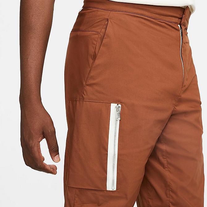 On Model 5 view of Men's Nike Sportswear Style Essentials Woven Unlined Cargo Pants in Pecan/Sail/Ice Silver/Pecan Click to zoom