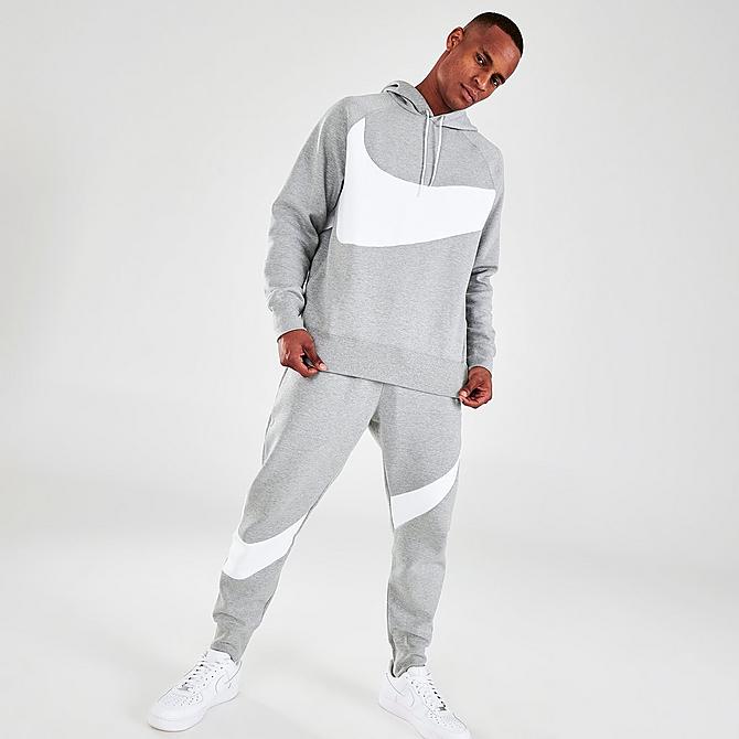 Front Three Quarter view of Men's Nike Sportswear Swoosh Logo Tech Fleece Pullover Hoodie in Dark Grey Heather/White/White Click to zoom