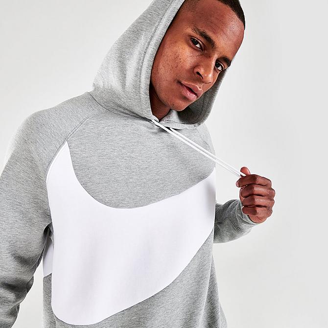 On Model 5 view of Men's Nike Sportswear Swoosh Logo Tech Fleece Pullover Hoodie in Dark Grey Heather/White/White Click to zoom