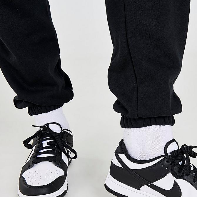 On Model 6 view of Women's Nike Sportswear Collections Essentials Fleece Cargo Pants in Black/White Click to zoom