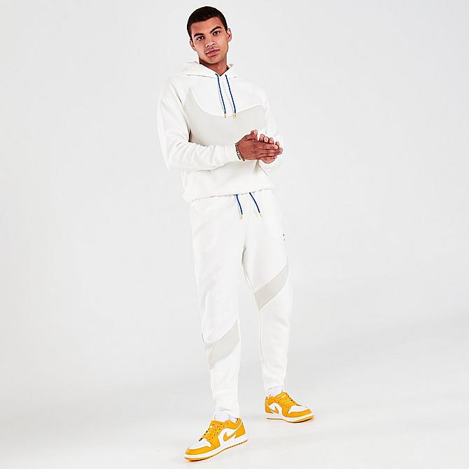Front Three Quarter view of Men's Nike Sportswear Swoosh Tech Fleece Jogger Pants in Sail Click to zoom