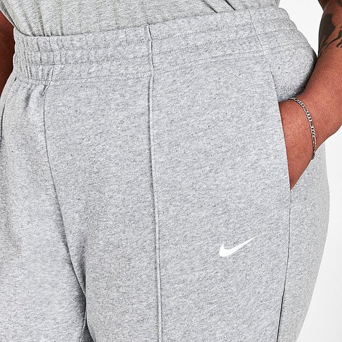 On Model 5 view of Women's Nike Sportswear Essential Fleece Jogger Pants (Plus Size) in Dark Grey Heather/White Click to zoom