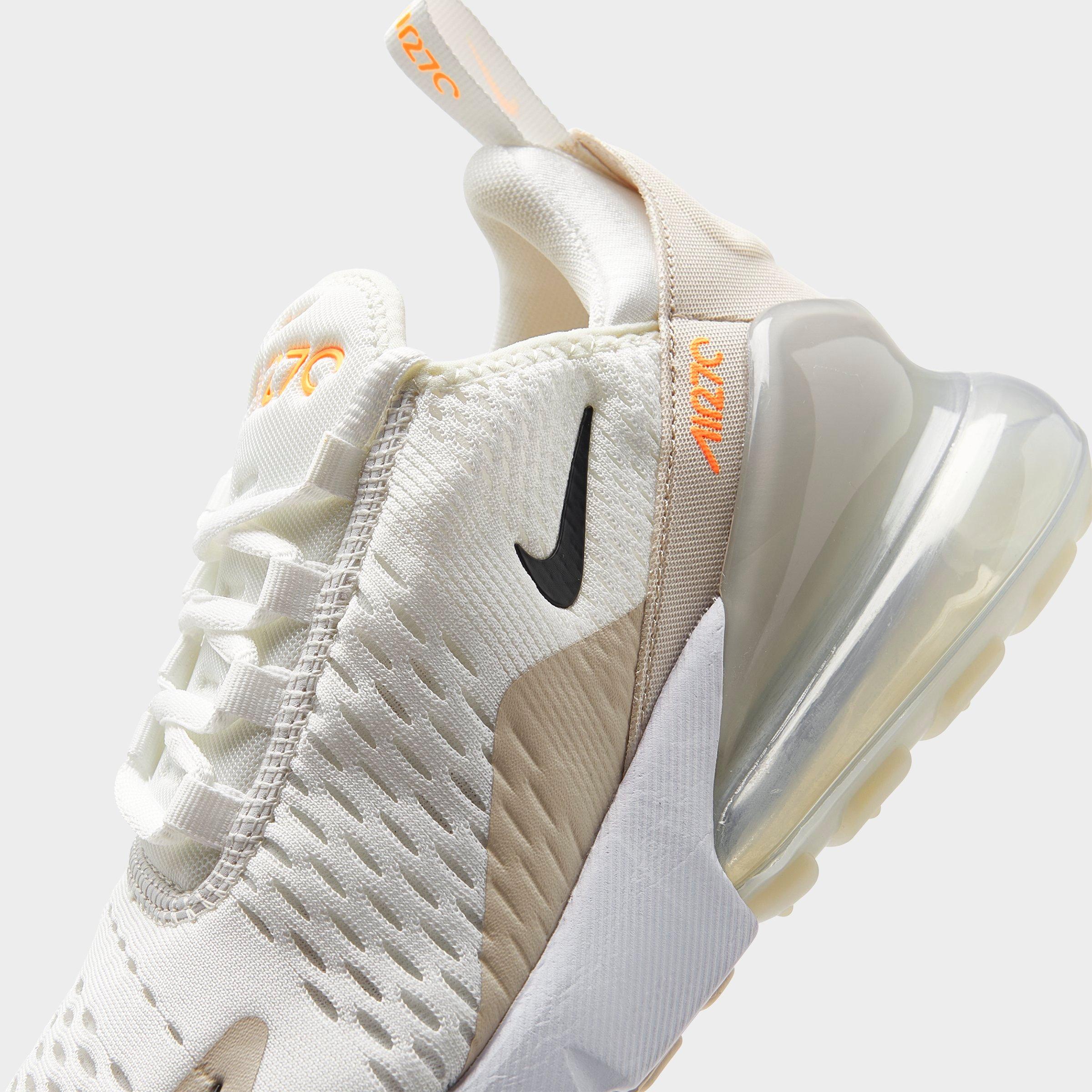 peach white and black nike air max