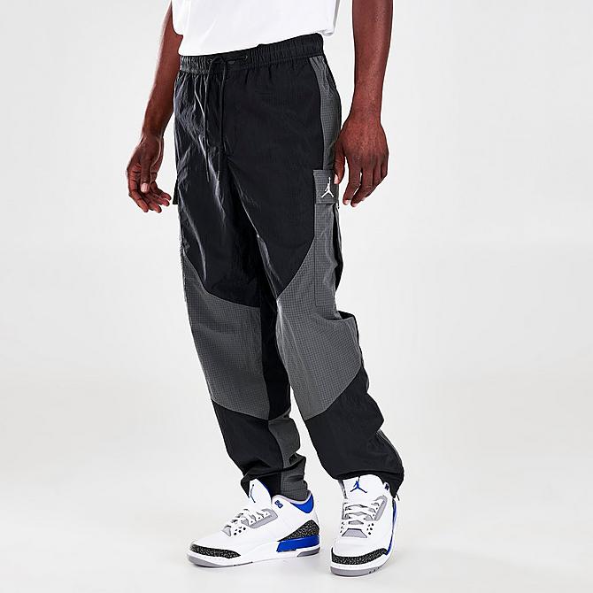 Front Three Quarter view of Men's Jordan 23 Engineered Woven Jogger Pants in Black/Iron Grey/Black/White Click to zoom