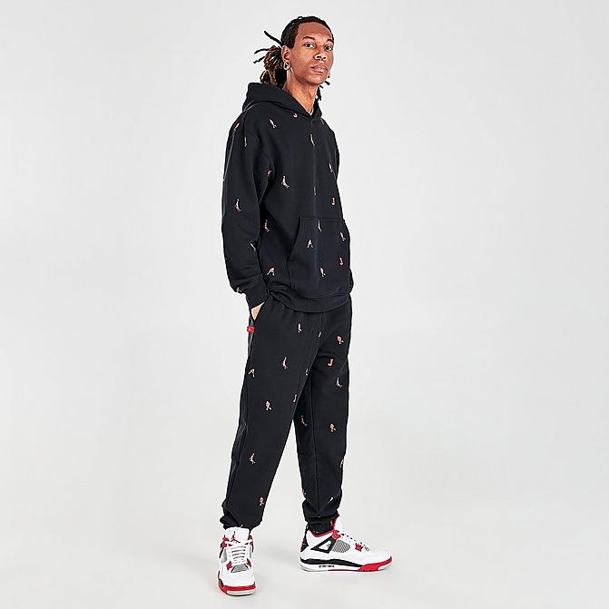 Front view of Men's Jordan Essentials Printed Fleece Jogger Pants in Black Click to zoom