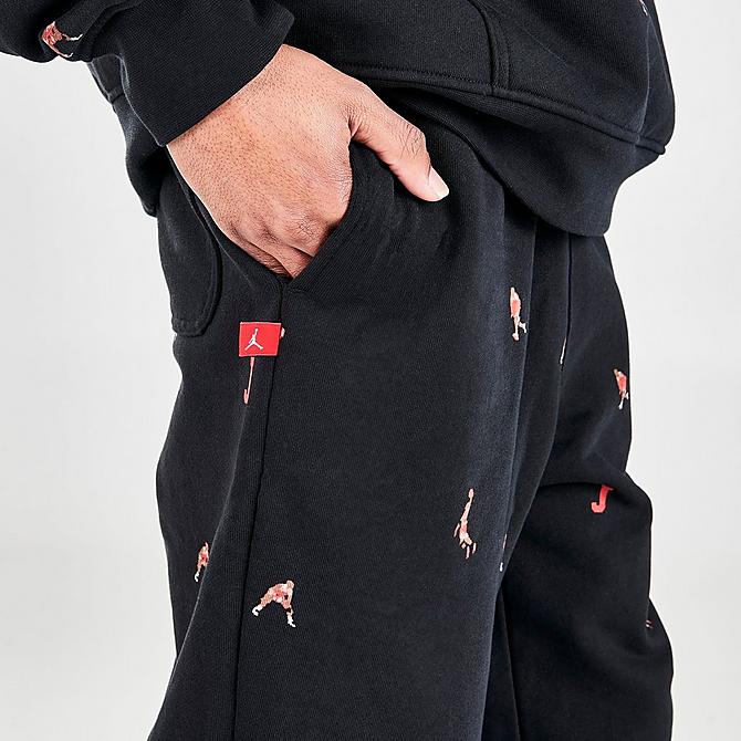 On Model 5 view of Men's Jordan Essentials Printed Fleece Jogger Pants in Black Click to zoom