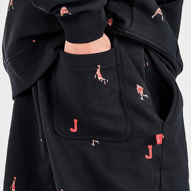 On Model 6 view of Men's Jordan Essentials Printed Fleece Jogger Pants in Black Click to zoom