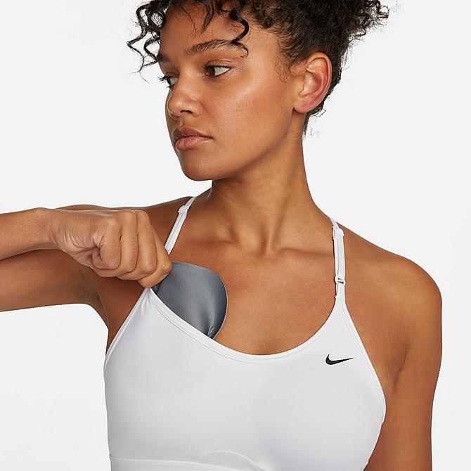 On Model 5 view of Women's Nike Dri-FIT Indy Strappy Light-Support Padded Sports Bra in White/White/Black Click to zoom
