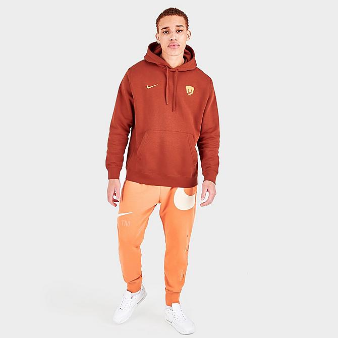[angle] view of Men's Nike Pumas UNAM Club Fleece Pullover Hoodie in Firewood Orange Click to zoom