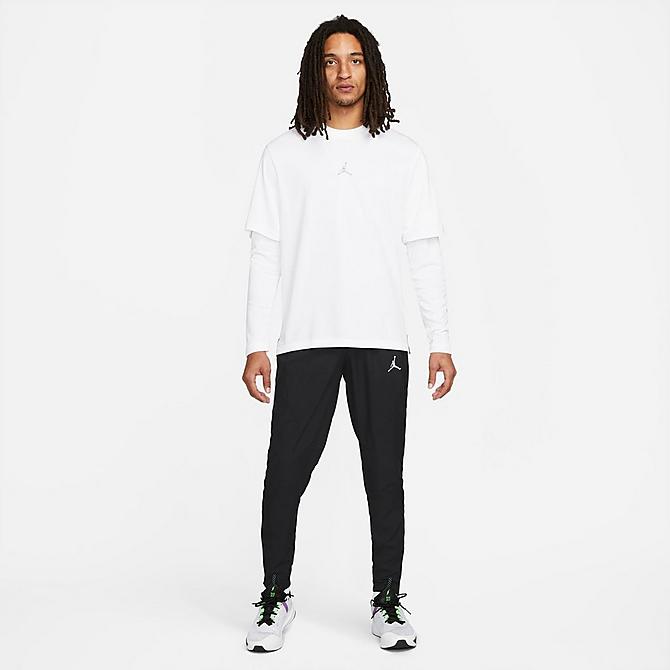 Front Three Quarter view of Men's Jordan Sport Dri-FIT Woven Athletic Pants in Black/Black/White Click to zoom