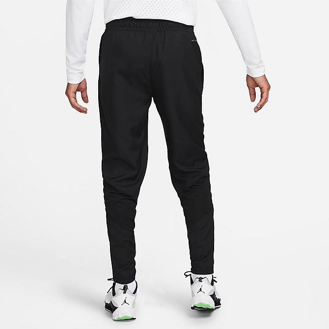 Back Left view of Men's Jordan Sport Dri-FIT Woven Athletic Pants in Black/Black/White Click to zoom