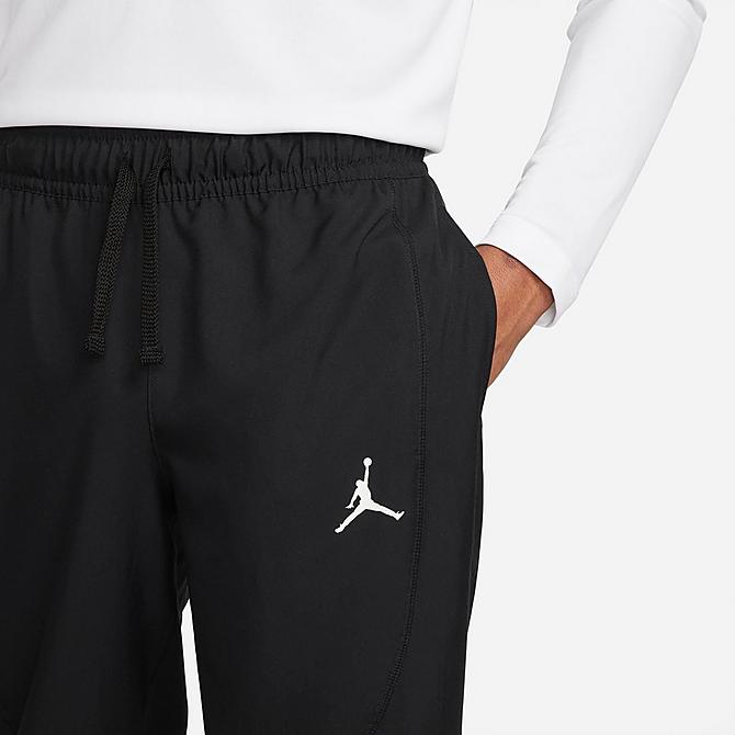 Back Right view of Men's Jordan Sport Dri-FIT Woven Athletic Pants in Black/Black/White Click to zoom