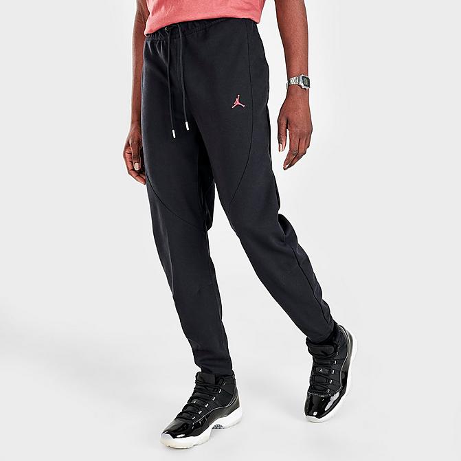 Front view of Men's Jordan Essentials Warmup Pants in Black/Gym Red Click to zoom