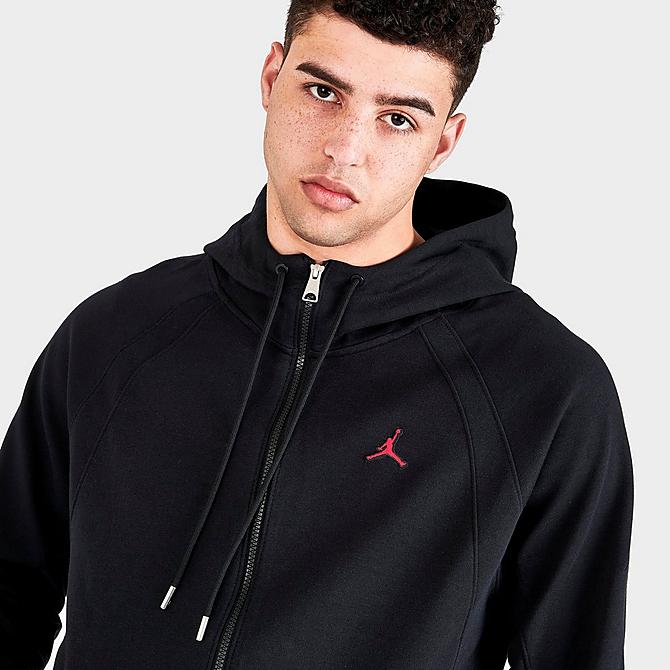 On Model 5 view of Men's Jordan Essentials Full-Zip Hooded Warmup Jacket in Black/Gym Red Click to zoom