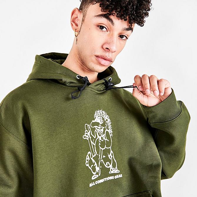 On Model 5 view of Men's Nike ACG Therma-FIT Troll Graphic Print Pullover Hoodie in Cargo Khaki/Black/Summit White Click to zoom