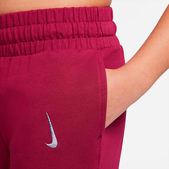 On Model 5 view of Girls' Nike Yoga Pants (Plus Size) in Rush Maroon Click to zoom