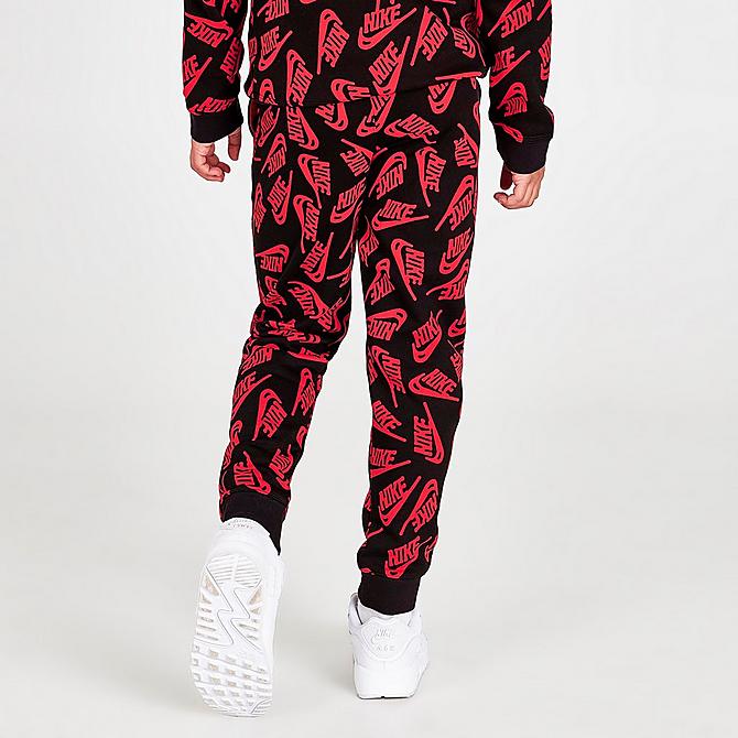 Back Right view of Kids' Nike Sportswear Allover Logo Jogger Pants in University Red/Black Click to zoom