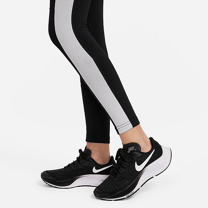 On Model 5 view of Girls' Nike Pro Warm Dri-FIT Leggings in Black/Light Smoke Grey/White Click to zoom