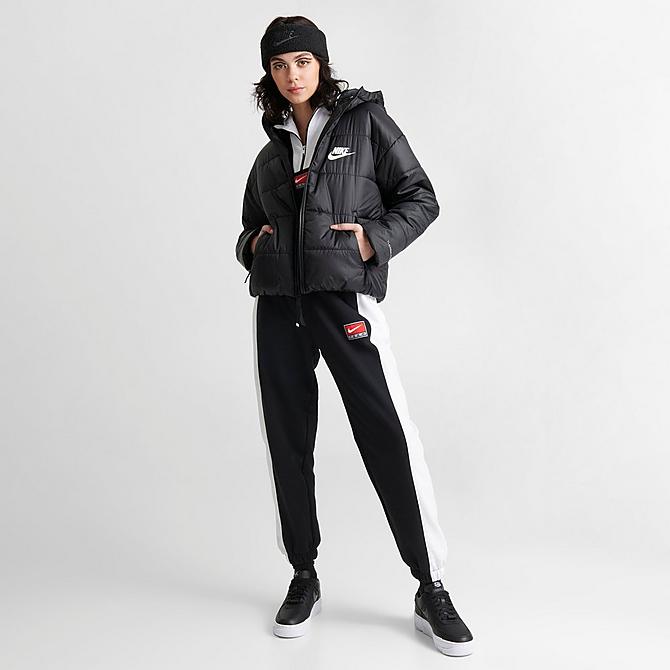 Front Three Quarter view of Women's Nike Sportswear Therma-FIT Repel Hooded Classic Puffer Jacket in Black/Black/White Click to zoom