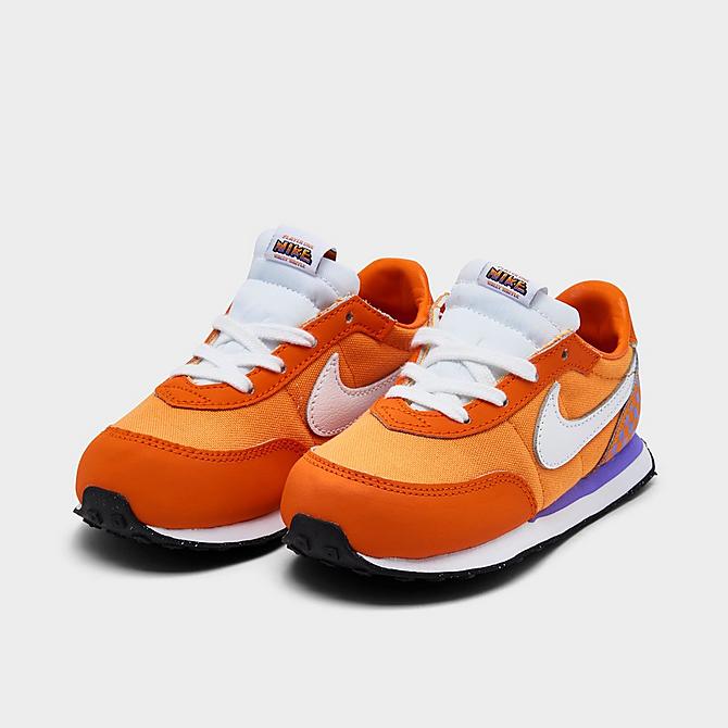 Three Quarter view of Kids’ Toddler Nike Waffle Trainer 2 SE Casual Shoes in Kumquat/White/Psychic Purple/Court Purple Click to zoom