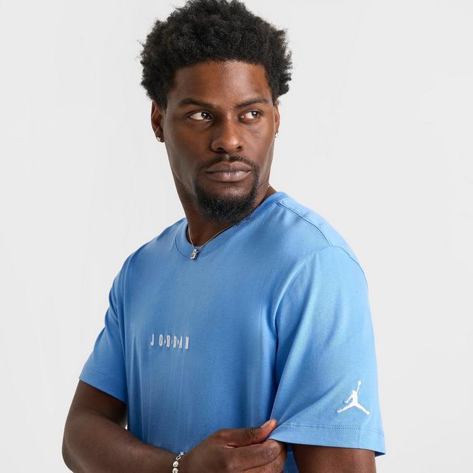 [angle] view of Men's Jordan Embroidered Air Graphic T-Shirt in Legend Blue/White Click to zoom