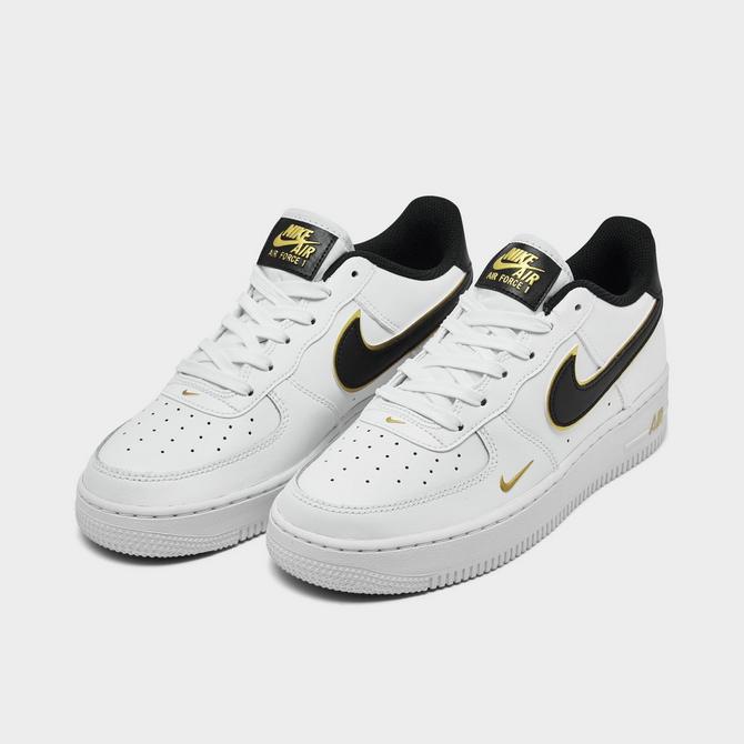 White black and store gold nike shoes