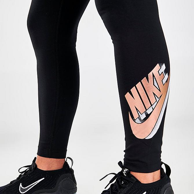 On Model 6 view of Women's Nike Sportswear Essential High-Waisted Metallic Printed Leggings in Black/Metallic Red Bronze Click to zoom