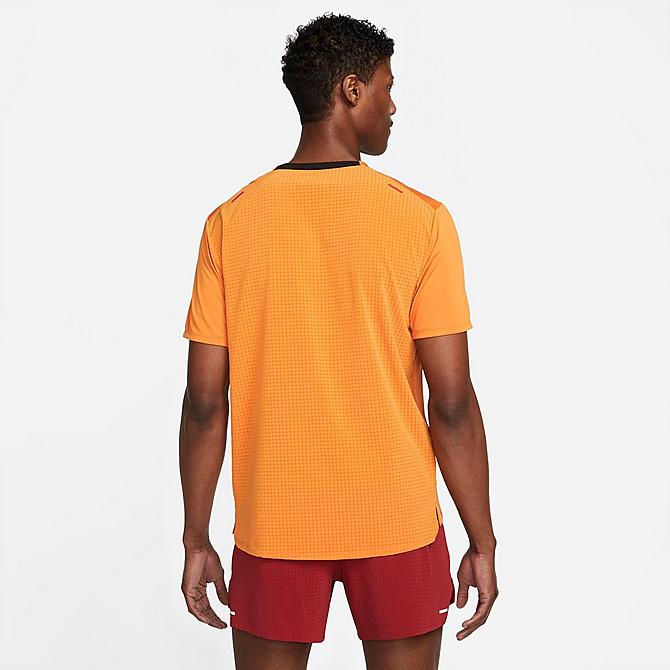 Front Three Quarter view of Men's Nike Dri-FIT Rise 365 Short-Sleeve Trail Running Top in Light Curry/Habanero Red Click to zoom