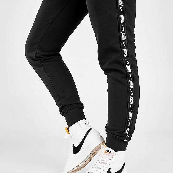On Model 5 view of Women's Nike Sportswear Essential Tape Fleece Jogger Pants in Black/White Click to zoom