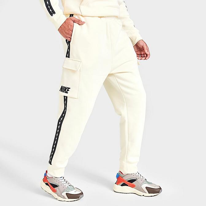 Front view of Men's Nike Sportswear Repeating Fleece Cargo Pants in Coconut Milk/Coconut Milk/Black Click to zoom