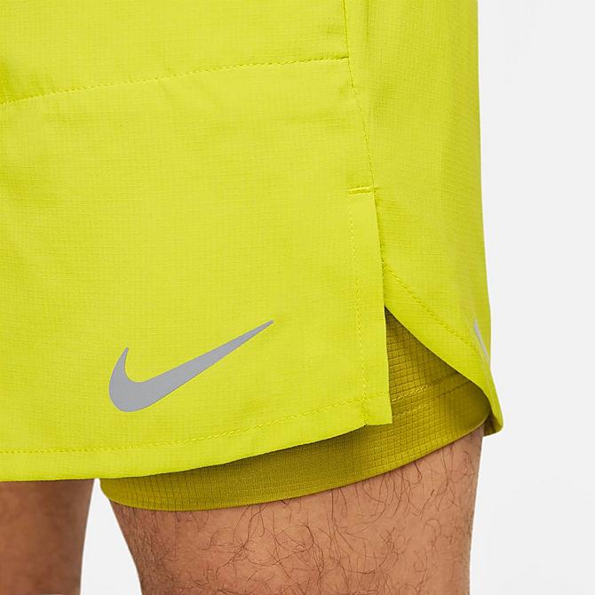 On Model 5 view of Men's Nike Dri-FIT Stride 2-in-1 7" Running Shorts in Bright Cactus/Moss/Moss Click to zoom