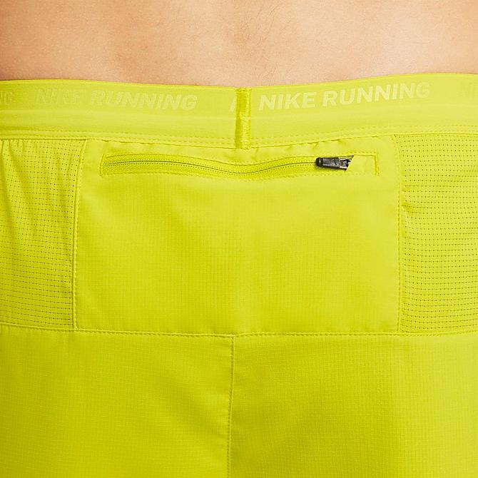 On Model 6 view of Men's Nike Dri-FIT Stride 2-in-1 7" Running Shorts in Bright Cactus/Moss/Moss Click to zoom
