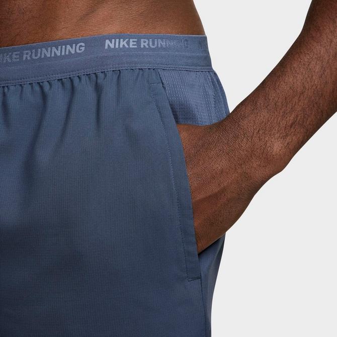[angle] view of Men's Nike Dri-FIT Stride Brief-Lined 7-Inch Running Shorts in Thunder Blue/Black Click to zoom