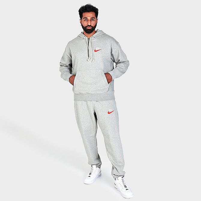 Front Three Quarter view of Men's Nike Sportswear French Terry Half-Zip Pullover Hoodie in Grey Heather Click to zoom