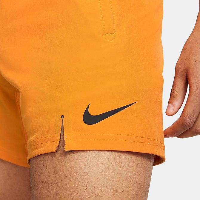 On Model 5 view of Men's Nike Pro Dri-FIT Flex 6" Training Shorts in Kumquat/Black Click to zoom